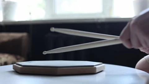 Close-up of hands practicing drum beats on a practice pad Stock Footage 341969283