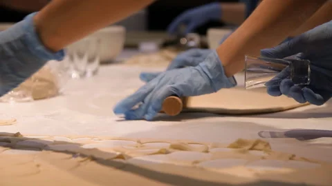Close-up of hands preparing dough for dumplings. Stock Footage 94959578