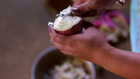 Close-Up of Hands Preparing Fresh Palm Fruit for Traditional Cooking Видео 339761199