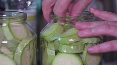 Close-up of Hands Preparing Fresh Zucchini Slices for Home Food Preservation 스톡 동영상 339647153