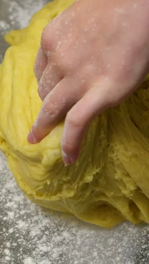Close up of hands preparing seeded dough on a flat surface covered in flour Stock Footage 301743381