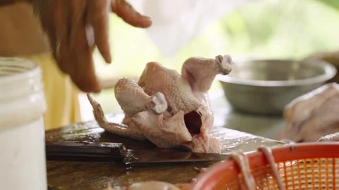 Close Up of Hands Preparing Whole Chicken for Plastic Bag Packaging Stock Footage 341173319