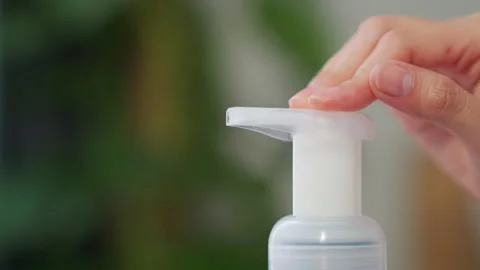 Close-up of hands press the alcohol bottle to clean. 스톡 동영상 146821264