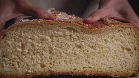 Close up of hands that press a traditional bread. Healthy, natural food for meal Stock Footage 147939279