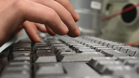 Close up of hands pressing computer keyboard keys in slow motion Stock Footage 332046560