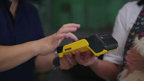 Close-Up Hands Processing Credit Card Payment/ Buy and Sell Products &amp; Servic 스톡 사진