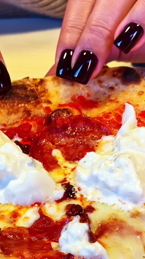 Close Up Of Hands Pulling Slice Of Gourmet Pizza With Burrata Cheese Stock Footage 336228632