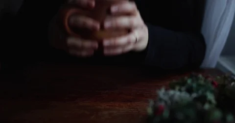 Close-up hands put on the table a brown ceramic mug Stock Footage 129710177