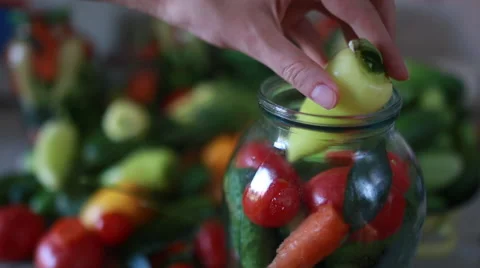 Close up hands put vegetables into a can Stock Footage 67397112