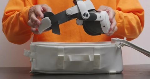 Close-up. Hands puts VR headset in protective backpack. Stock Footage 266765642