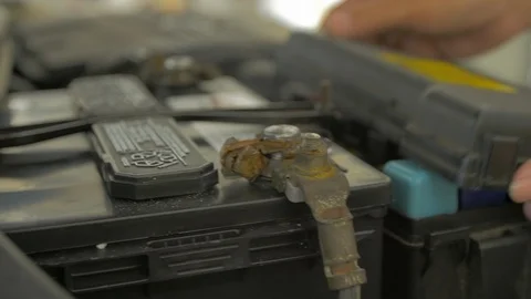 Close up of hands putting case over engine fuse box Stock Footage 94813037