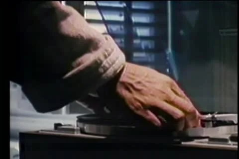 Close-up of hands putting record on turntable Stock Footage 11350310