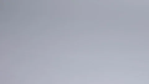 Close-up of hands putting stack of fresh bath towels on the bed sheet. Room Stock Footage 124128520