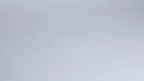 Close-up of hands putting stack of fresh bath towels on the bed sheet. Room Stock Footage 124327322