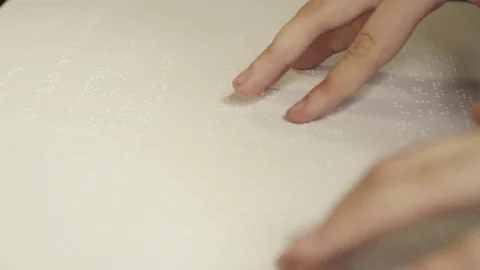 Close up of hands reading braille Stock Footage 75191411