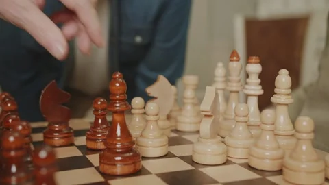 Close-up of hands rearranging chess pieces on the board. Pawn move. Stock Footage 235017907