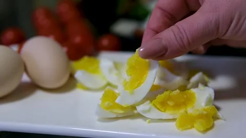 Close-up of hands removing the golden shell from a hard-boiled Easter egg Stock Footage 302760859