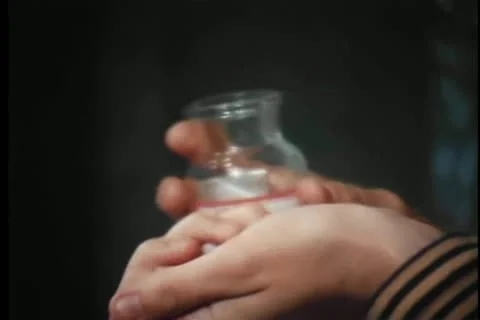 Close-up of hands removing pill from capsule Stock Footage 11366307