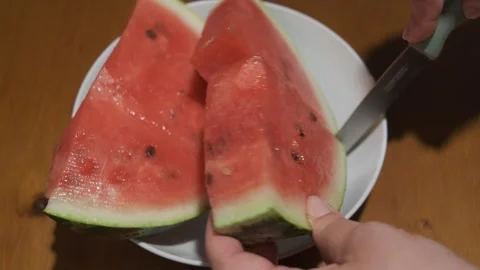 Close-up of Hands Removing Seeds From Watermelon Slices Stock Footage 342559118