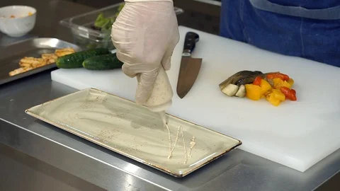 Close-up hands. The restaurant's cook is making a vegetable salad. Cabbage Stock Footage 127601057