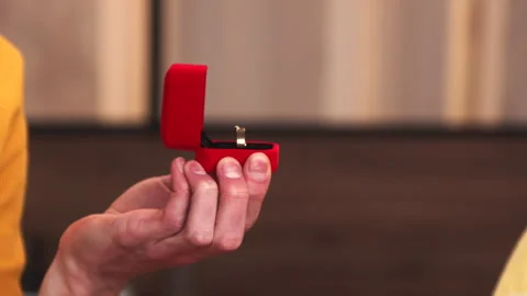 Close Up of Hands with Romantic Proposal Ring in Red Box Video stock 276386726