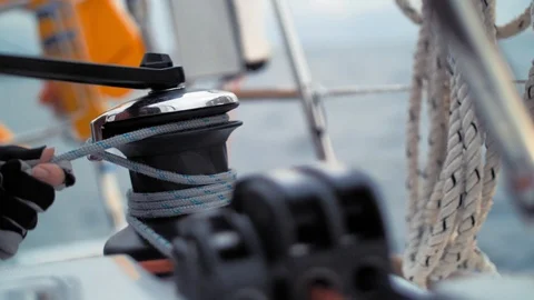 Close-up. Hands sailor wind the rope using winch. Sea voyage around Norway Stock Footage 88410080