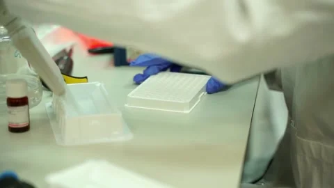Close up of the hands of a scientist taking tests in a laboratory Stock Footage 145867542