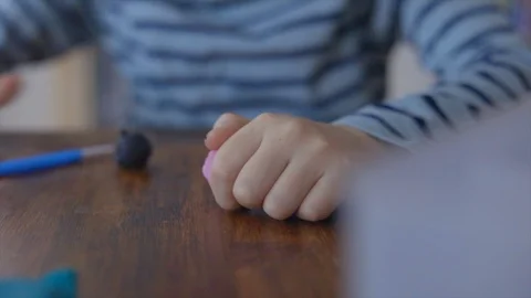 Close up hands sculpts plasticine shape Stock Footage 101844609