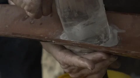 Close-up of Hands Sealing Solar Bottle Light on Roof Tile with Caulk, Conde Stock Footage 320571235