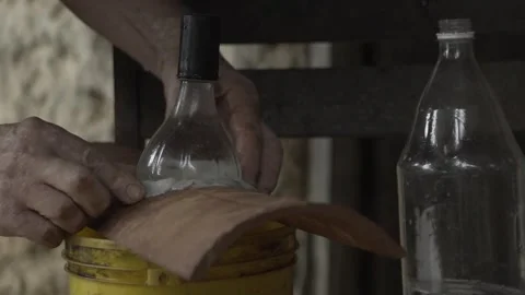 Close-up of Hands Sealing Solar Bottle Light on Roof Tile with Caulk, Conde Stock Footage 320571251