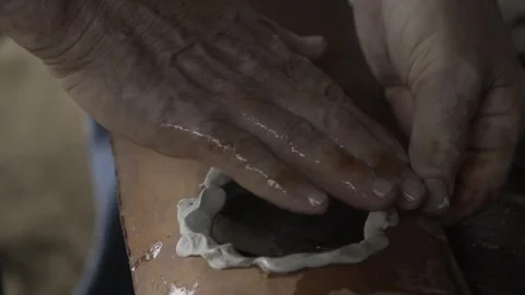 Close-up of Hands Sealing Solar Bottle Light on Roof Tile with Caulk, Conde Stock Footage 320571294