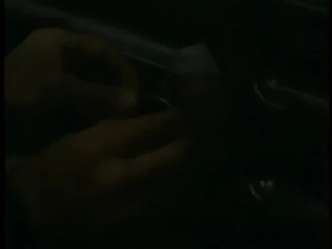 Close-up of hands setting timer on home-made bomb Stock Footage 260252170