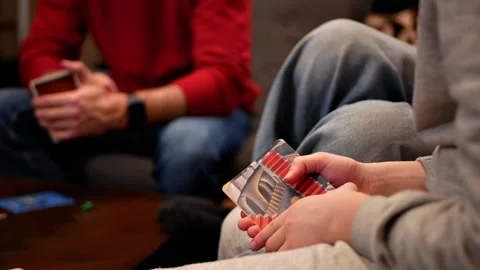 Close-up of the hands of several people playing board games Video stock 220611075