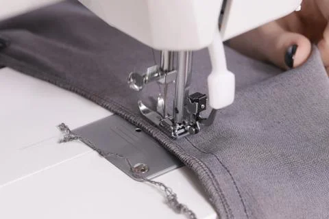 Close-up of hands sewing on machine Stock Photos