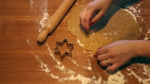 Close-up of hands shaping the dough with molds to make homemade cookies Stock Footage 167497018