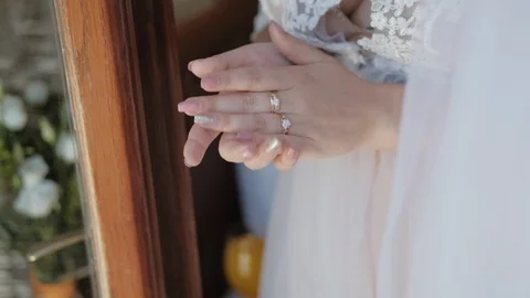 Close-up of hands with shiny manicure Young beautiful bride Stock Footage 90376767