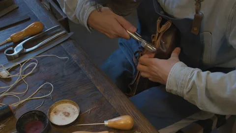 Close up hands shoemaker sews shoes to order. Shoe manufacturing workshop Stock-Footage 137402506