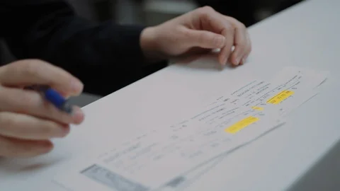 Close up Hands showing on tickets the time and gate departure, Airport Stock Footage 109285139