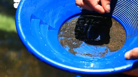Close Up of Hands Sifting through rocks in gold pan - Shallow Depth of Field Stock Footage 114795172