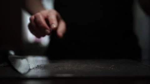 Close-Up of Hands Slicing Fresh Salmon Fillet on a Dark Background 스톡 동영상 296234418