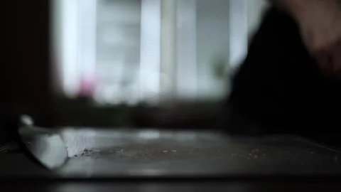 Close-Up of Hands Slicing Fresh Salmon Fillet on a Dark Background Stock Footage 296423596