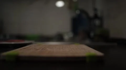 Close-Up of Hands Slicing Fresh Salmon Fillet on a Dark Background Stock Footage 296427336