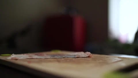 Close-Up of Hands Slicing Fresh Salmon Fillet on a Dark Background Vidéo 296428457