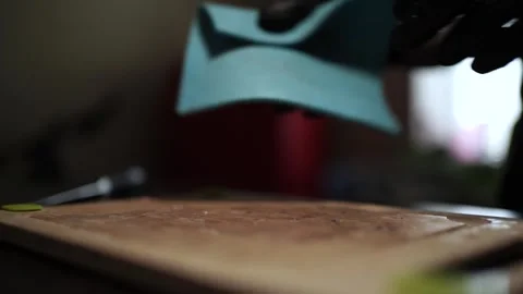 Close-Up of Hands Slicing Fresh Salmon Fillet on a Dark Background Stock-Footage 303891863