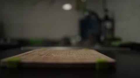 Close-Up of Hands Slicing Fresh Salmon Fillet on a Dark Background Stock-Footage 303893745
