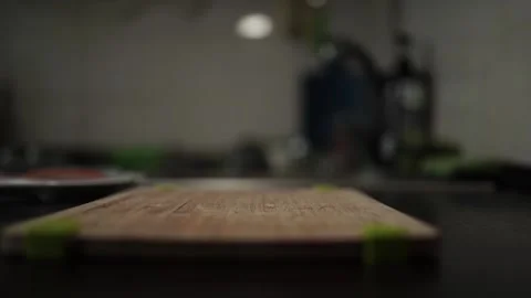 Close-Up of Hands Slicing Fresh Salmon Fillet on a Dark Background Video stock 303898944