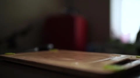 Close-Up of Hands Slicing Fresh Salmon Fillet on a Dark Background Stock Footage 303898992