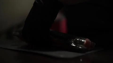 Close-Up of Hands Slicing Fresh Salmon Fillet on a Dark Background Stock-Footage 303898993