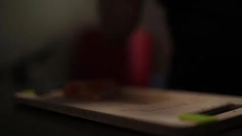 Close-Up of Hands Slicing Fresh Salmon Fillet on a Dark Background Stock-Footage 303903608