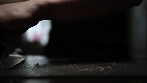 Close-Up of Hands Slicing Fresh Salmon Fillet on a Dark Background Stock Footage 303906301